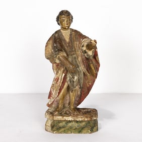 A Spanish Colonial painted and parcel gilt figure of a saint