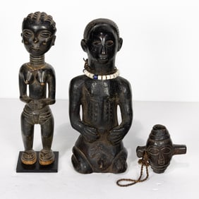 A group of three West African wood carvings