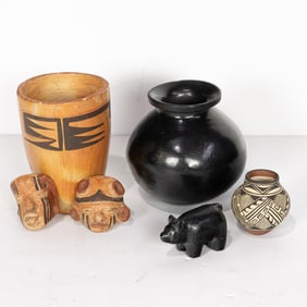 A group of Native American pottery and carvings