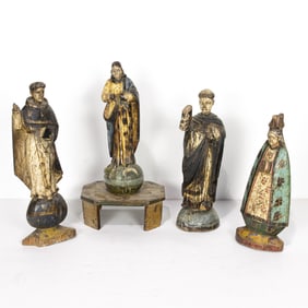 A group of four Philippine polychrome wood santos figures