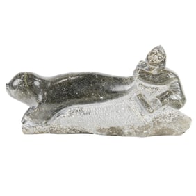 An Inuit stone figure of a seal hunter