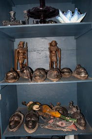A collection of African masks and figural bookends, Senator Feinstein Estate