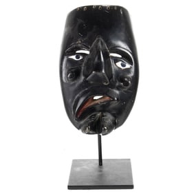 A Mexican black painted festival mask