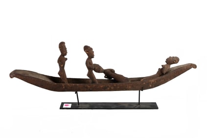 A Salampasu ritual wood boat with four masked attendants