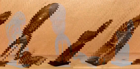 Four West African heddle pulleys