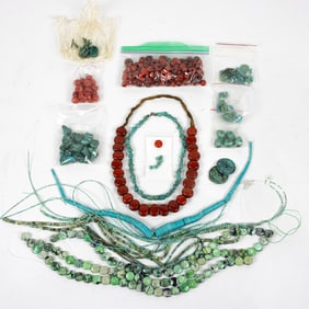 A group of stone beads, including turquoise and coral
