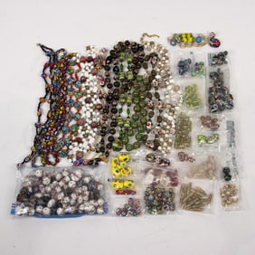 A group of mainly glass beads, including millefiore, Venetian and art glass