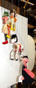 A group of vintage puppet marionettes
