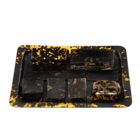 A group of tortoiseshell and faux tortoiseshell table articles