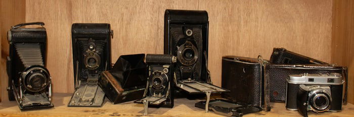 A group of nine antique and vintage Kodak cameras