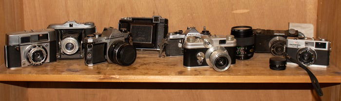 Eight vintage cameras, including Zeiss, Agfa and Pentax
