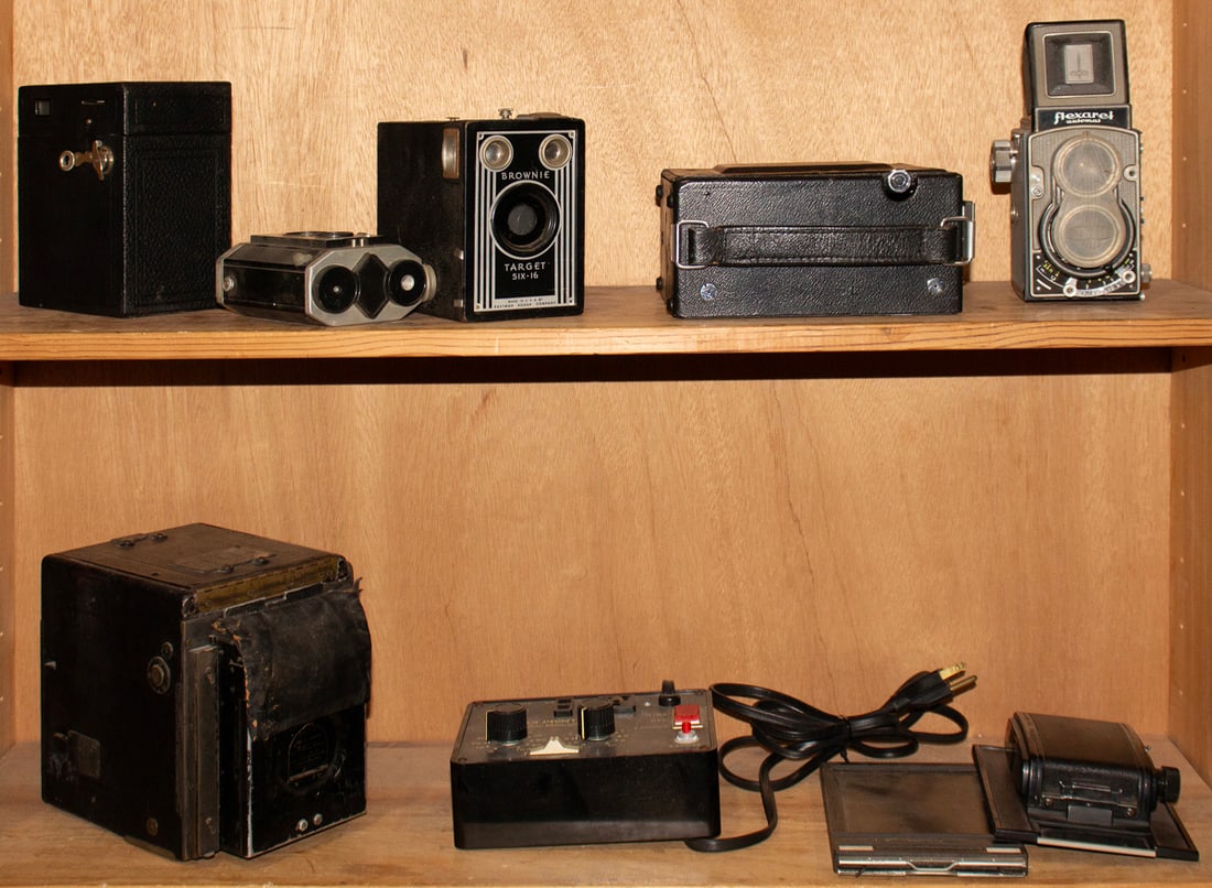 Nine vintage and antique cameras and accessories: Nine vintage and antique cameras and accessories, including Brownie Target Six-16; Brownie Reflex Syncro Model; Graflex Speed Graphic Model 4C large format camera; Graflex Series B; Flexart Automat; w
