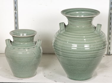 Two Simon Pearce graduated celadon crackle glazed porcelain vases