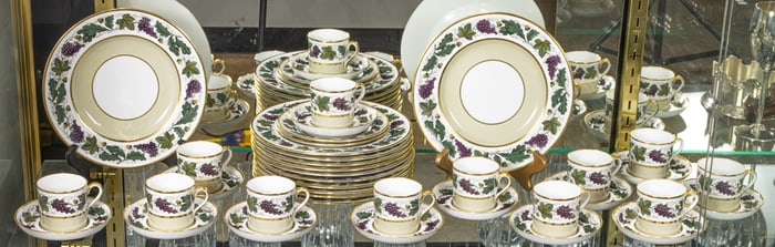 A Spode partial porcelain lunch service in the Regency taste decorated with grapevine borders