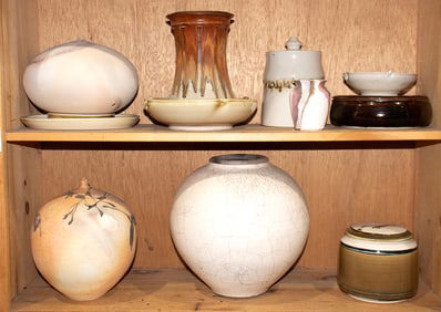 A collection of art pottery comprising vessels