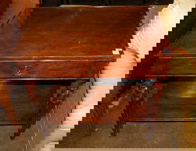 A mahogany side table in the English taste: A mahogany side table in the English taste, fitted with single drawer over turned legs and open shelf, 28.25"h x 32"w x 20.5"d Provenance: The Estate of Senator Dianne Feinstein (1933-2023)