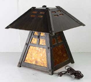 An Arts & Crafts style patinated metal table lamp