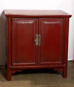 A Chinese red lacquered two-door cabinet
