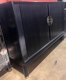 A Chinese black lacquered cabinet