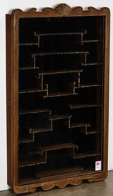A Chinese hardwood hanging snuff bottle display cabinet