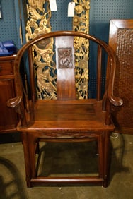 A pair of Chinese mixed-wood horseshoe-back armchairs
