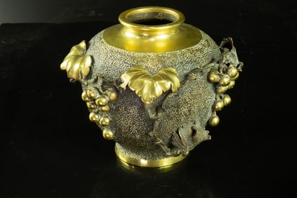 A Japanese bronze vase with grapes