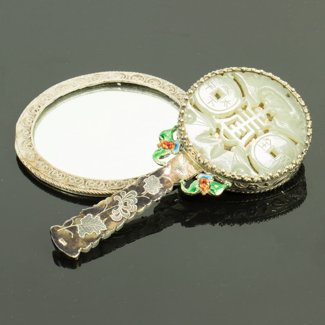 A Chinese silver and jade inlaid hand mirror (1 of 1)