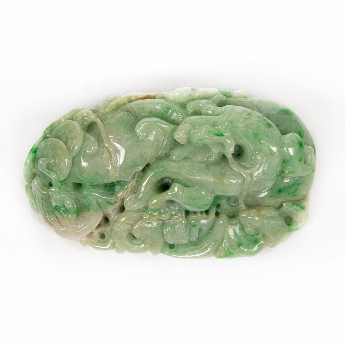 A Chinese green jadeite toggle: A Chinese green jadeite toggle. 3" high.