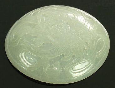 A Chinese white jade circular plaque