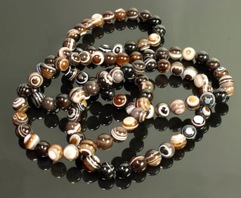 A strand of Chinese banded agate beads