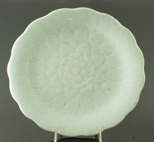 A Chinese celadon glazed 'lotus' lotus plate dish