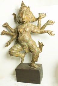 A large Indian gilt bronze figure of the three-headed Ganesh on a wood stand