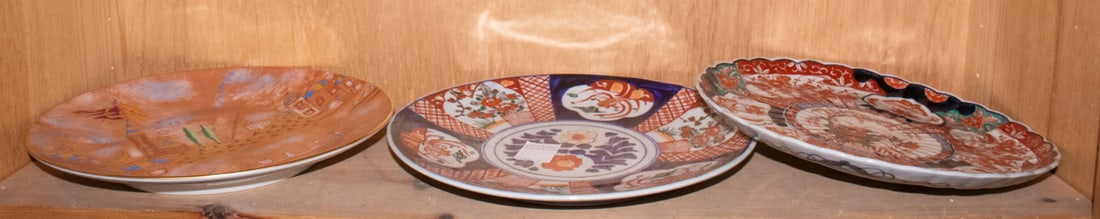 A shelf of Japanese Imari dishes and plates: A shelf of Japanese Imari dishes and plates. 19th century and later, 14.75" widest.