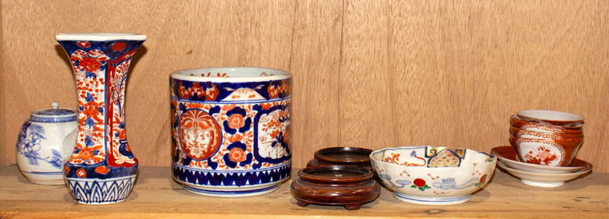 A shelf of Japanese porcelain articles: A shelf of Japanese porcelain articles. Meiji period, 7.75" tallest.