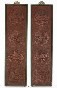 A pair of Chinese carved red lacquer wall panels