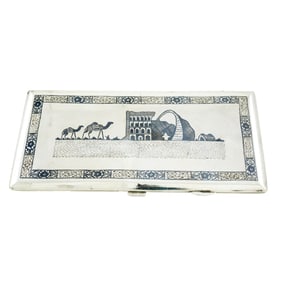 A Persian silver cigarette case