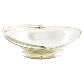 A George III William Stroud sterling cake basket with armorial
