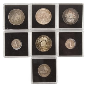 Seven mixed silver coins: Iowa 1946 50-cents commemorative (cubu); 1876 50-cents 1949D 50-cents chbu