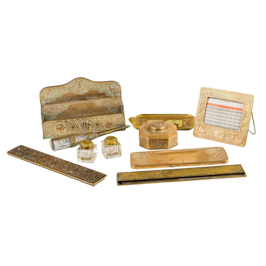 A Tiffany Studios gilt bronze desk set in the Zodiac pattern (1 of 5)