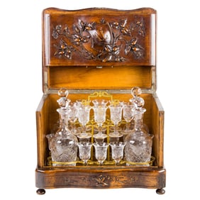 A French or German walnut tantalus/liquor cabinet