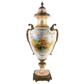 A large Sevres style bronze mounted porcelain covered urn
