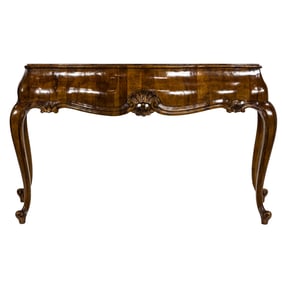 A Baroque style inlaid and parcel gilt console table