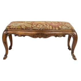 A Louis XV style walnut bench with needlepoint upholstery