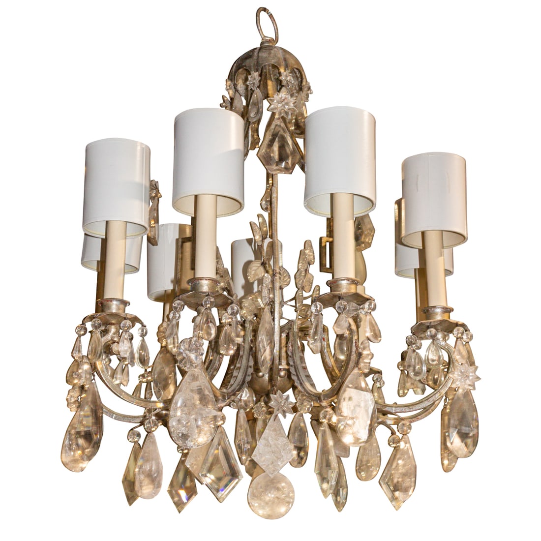 A Bauges style silvered iron and rock crystal nine-light chandelier: A Bauges style silvered iron and rock crystal nine-light chandelier, the scrolled cage enclosing leaf sprays and issuing down scrolled candlearms, all profusely hung with tear drop and diamond shaped 