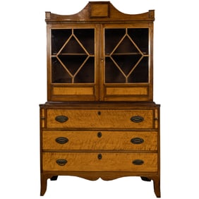 A Federal bow front birdseye maple secretary circa 1810