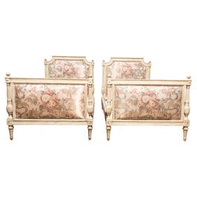A pair of Louis XVI style painted and floral upholstered twin beds