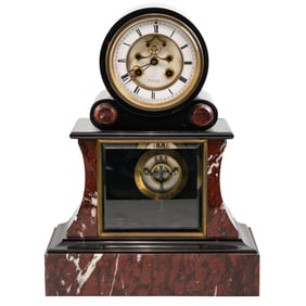 A French rouge and black marble mantle clock