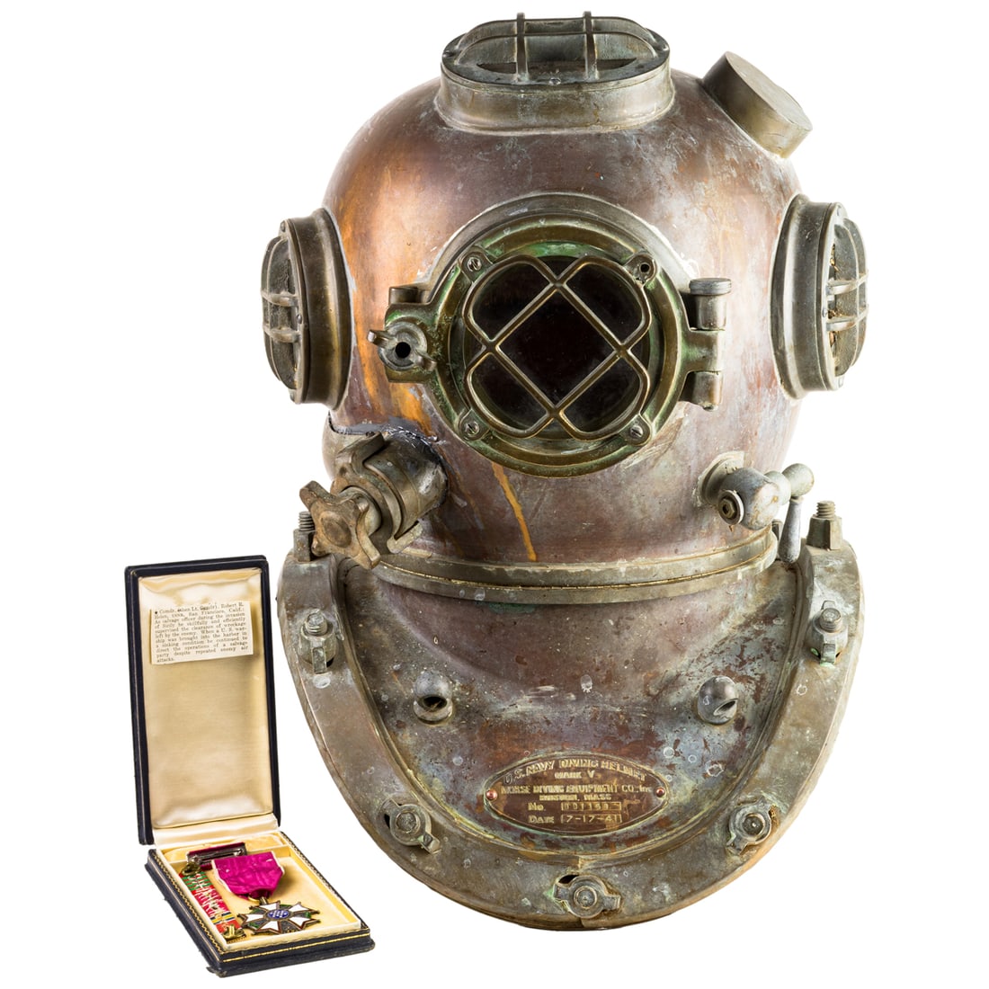 A reproduction US Navy Morse Mark V Diving Helmet and a medal to Commander Robert R. Helen: A US Navy style Mark V diving helmet marked Morse Diving Equipment Co., reproduction, with later date and serial number, dated 1941, and serial 001159, accompanied by a Legion of Merit Legionaire meda