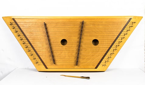 A hammered dulcimer with folding stand