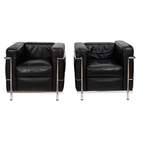 A pair of Italian Le Corbusier LC2 style armchairs